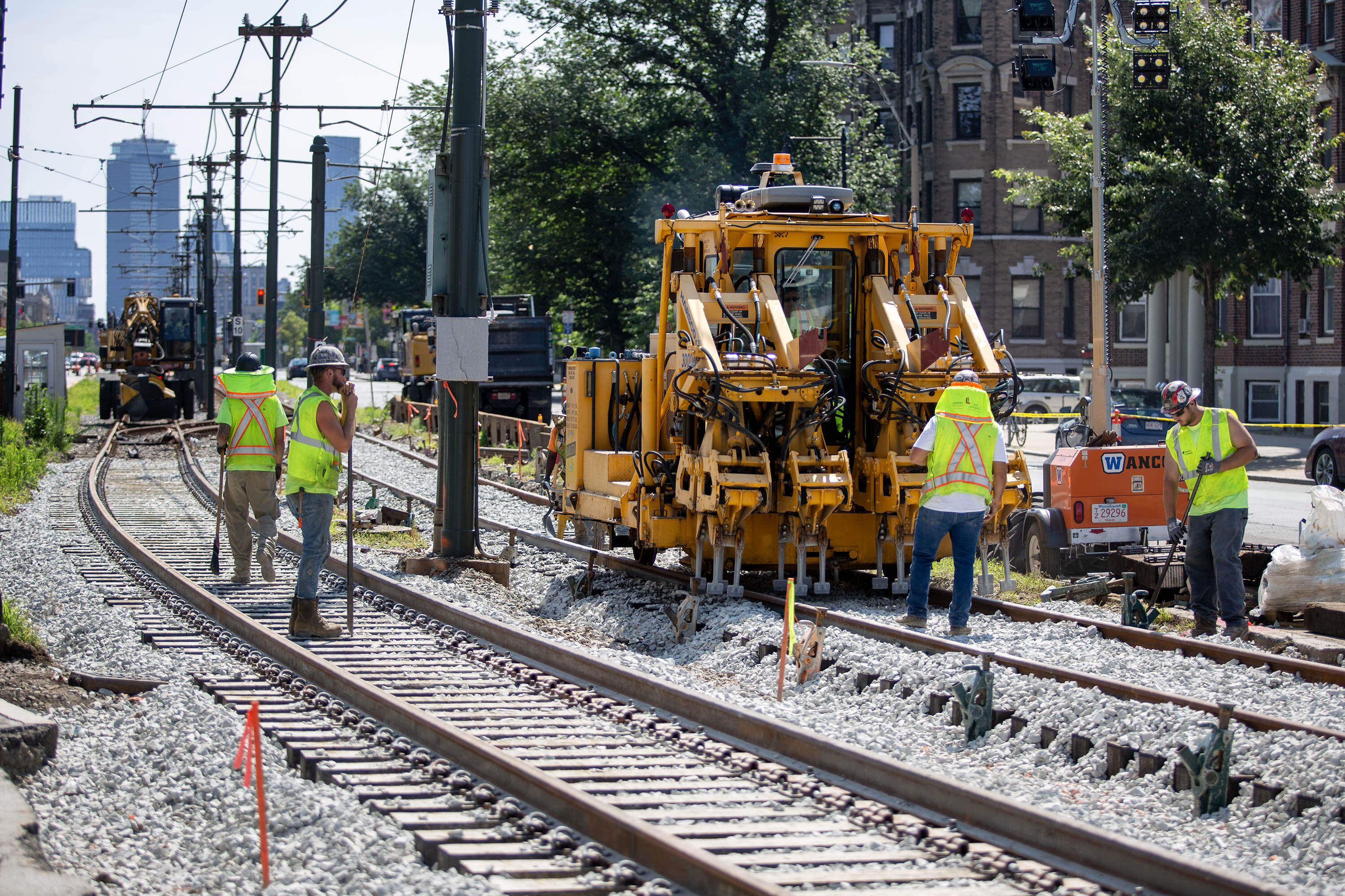 MBTA workers replace track on the Green Line at Packards Corner. (Robin Lubbock/WBUR)