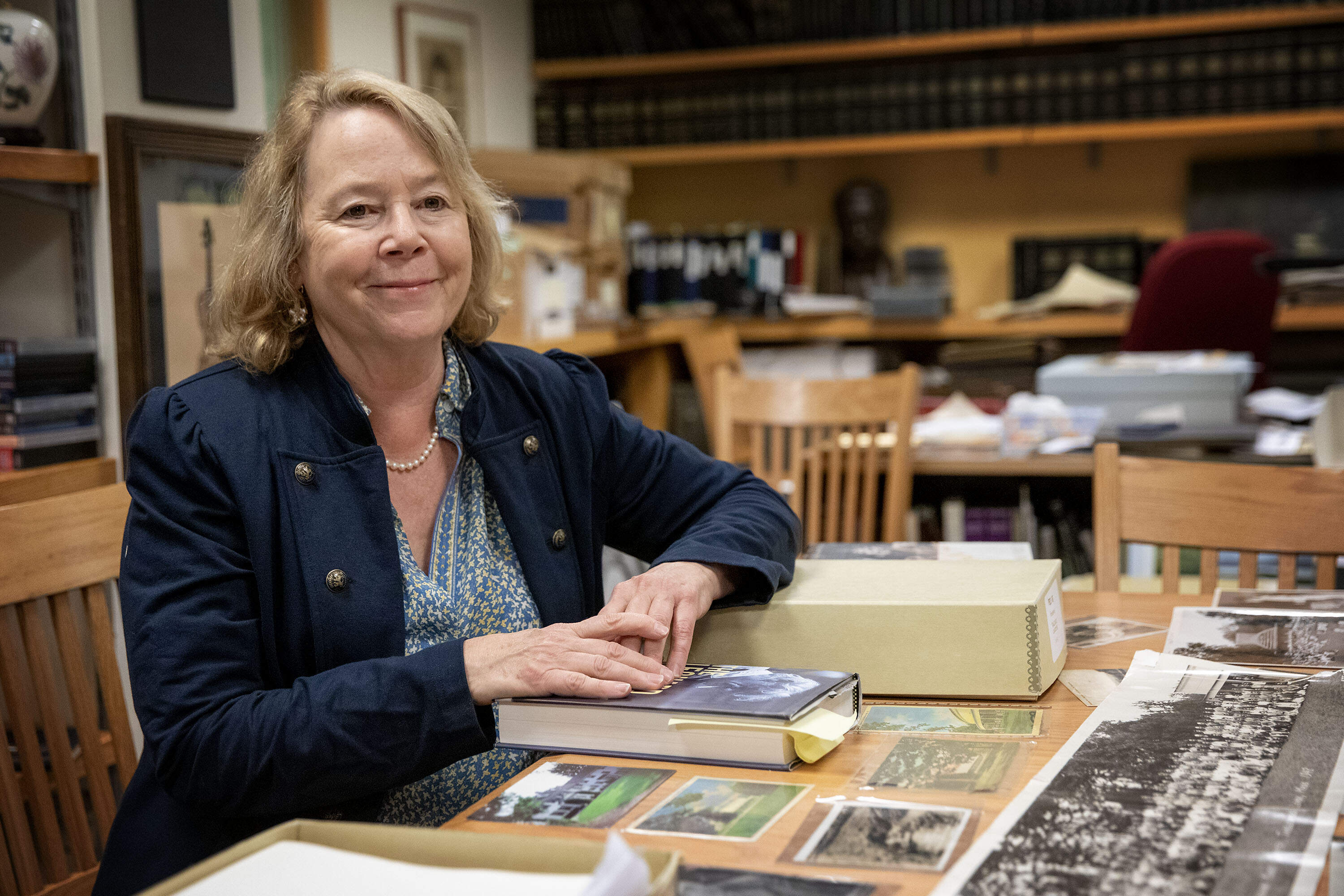 Surrounded by Bernstein memorabilia, BSO director of archives Bridget Carr talks with a visitor at the BSO archive in Symphony Hall. (Robin Lubbock/WBUR)