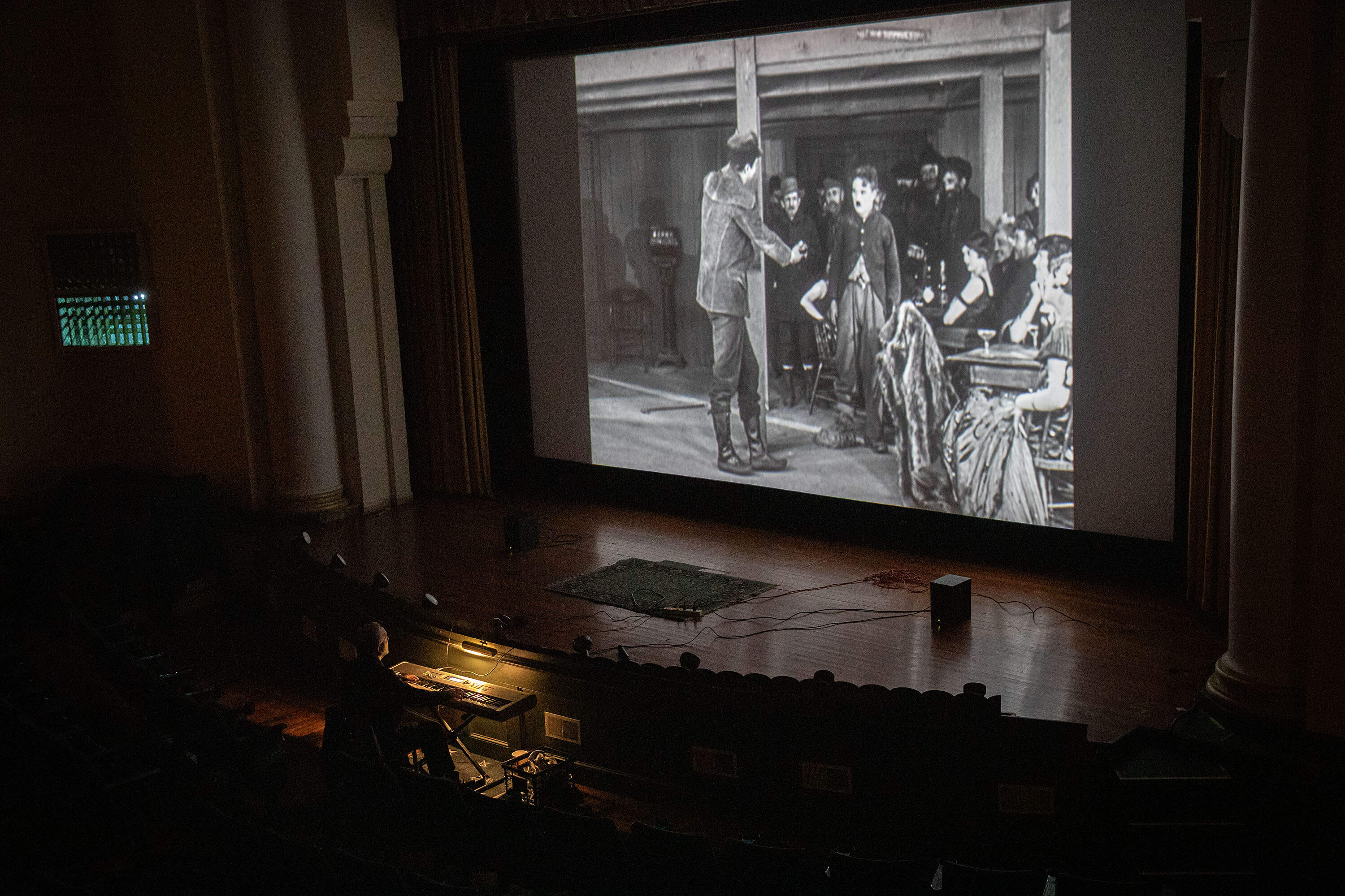 In the early days of silent cinema, films didn’t come with pre-written scores. A local musician might improvise the entire soundtrack in real time, much like Rapsis does today. (Robin Lubbock/WBUR)