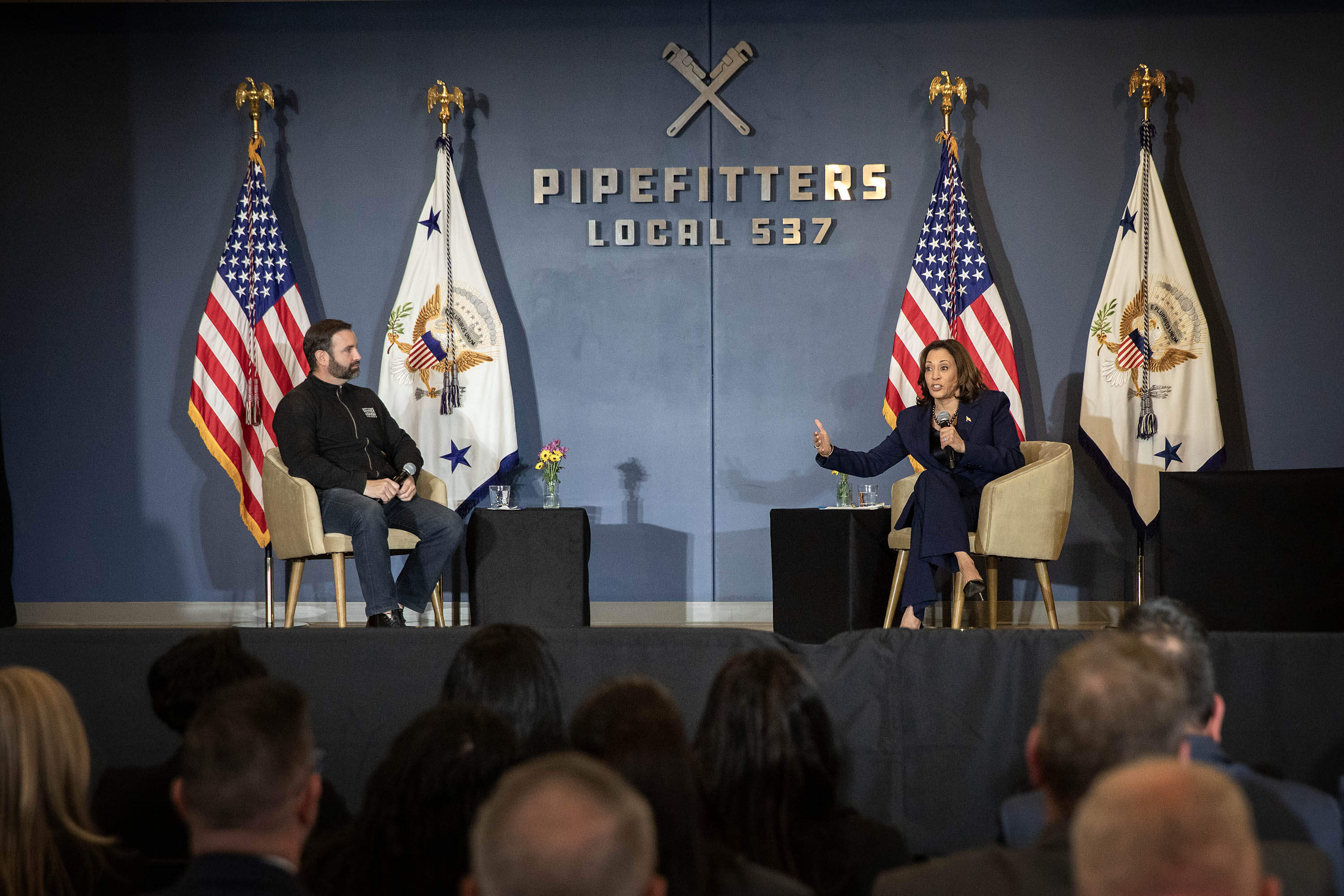 Vice President Kamala Harris talks with union members at Pipefitters Local 537 in Boston. (Robin Lubbock/WBUR)