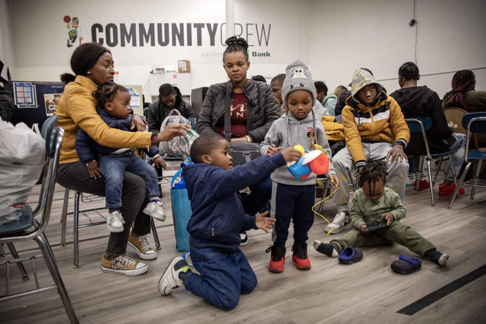 Families gathered at the Immigrant Family Services Institute, in Mattapan. (Robin Lubbock/WBUR)