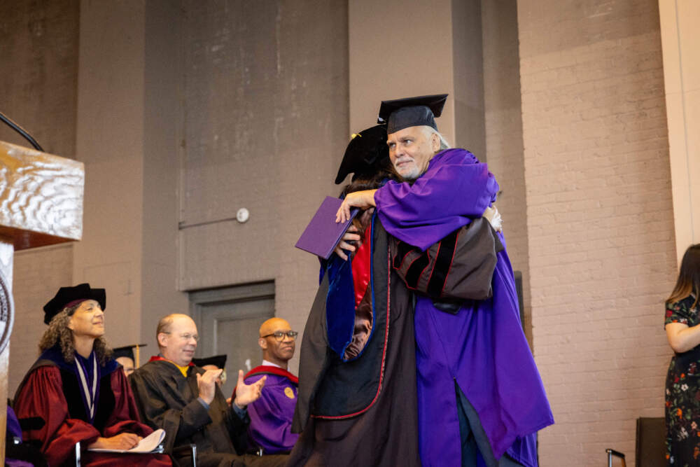 A Northwestern Prison Education Program graduate hugs a faculty member. (Courtesy of Northwestern University)