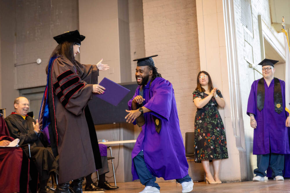 A Northwestern Prison Education Program graduate receives his diploma. (Courtesy of Northwestern University)