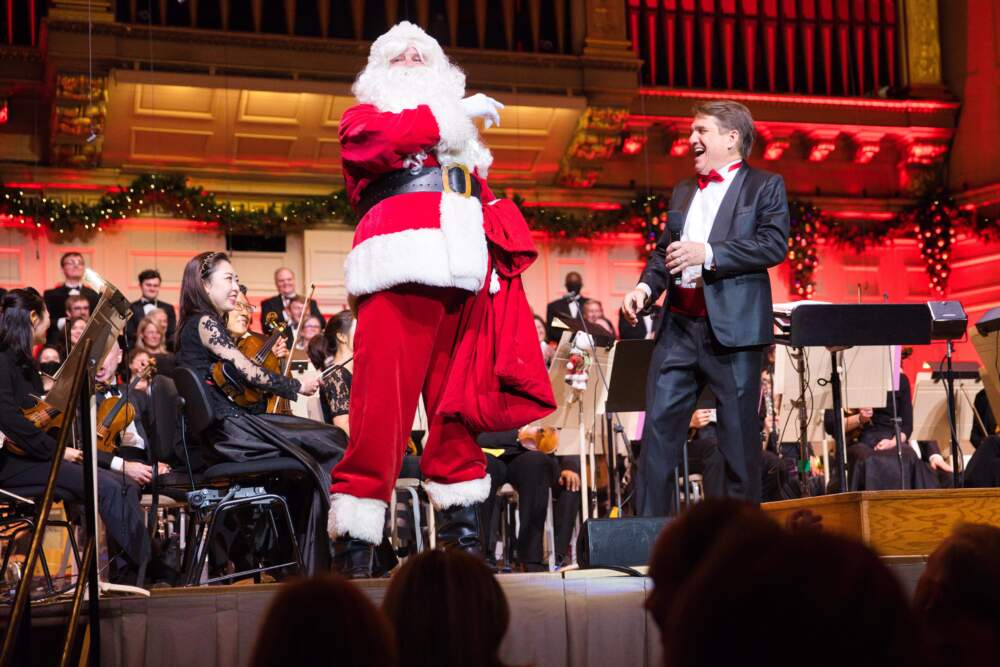 Santa Claus and Keith Lockhart onstage at the 2022 Holiday Pops. (Courtesy Hilary Scott/BSO)