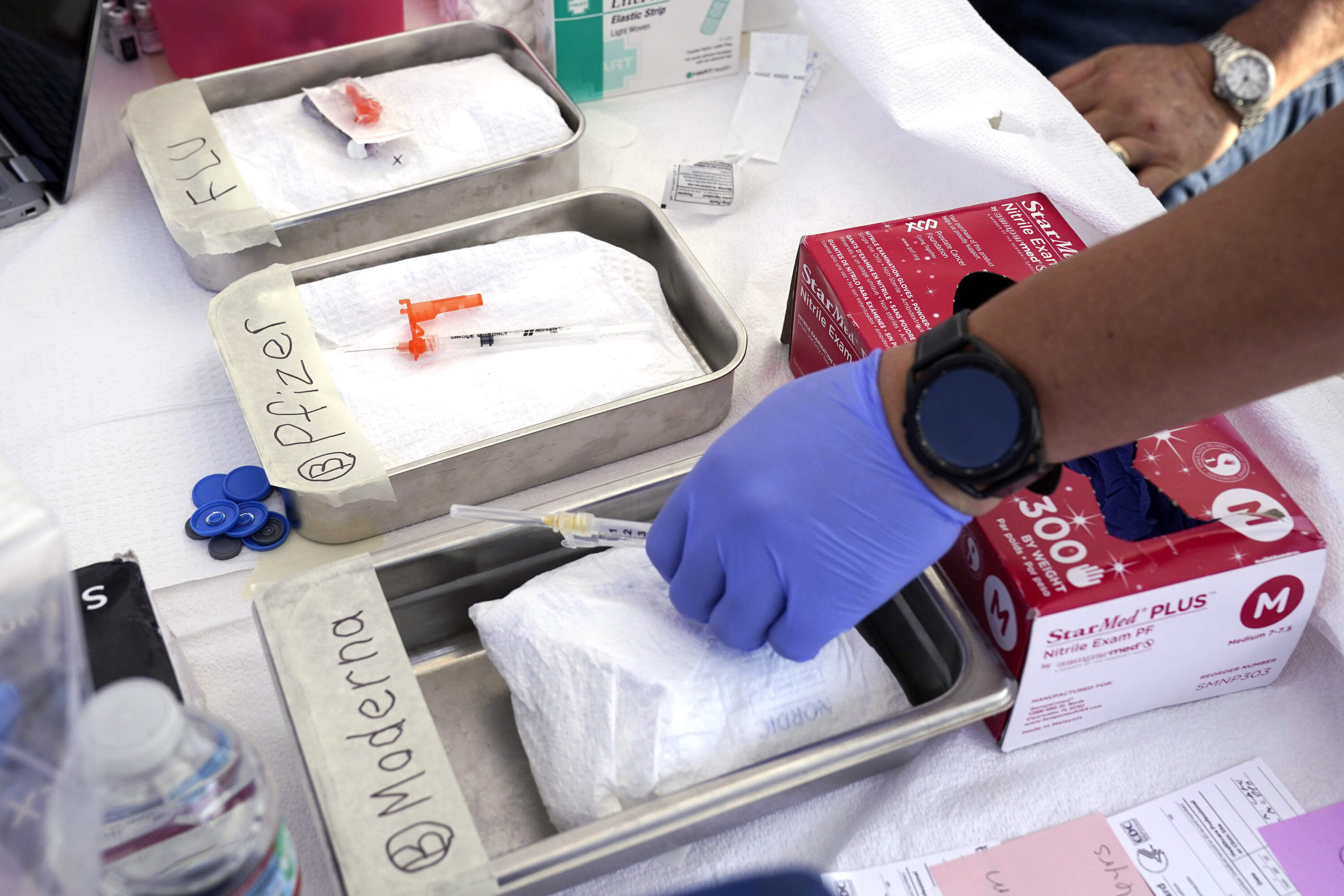 Lagging COVID, flu and RSV vaccination rates concern Mass. health officials