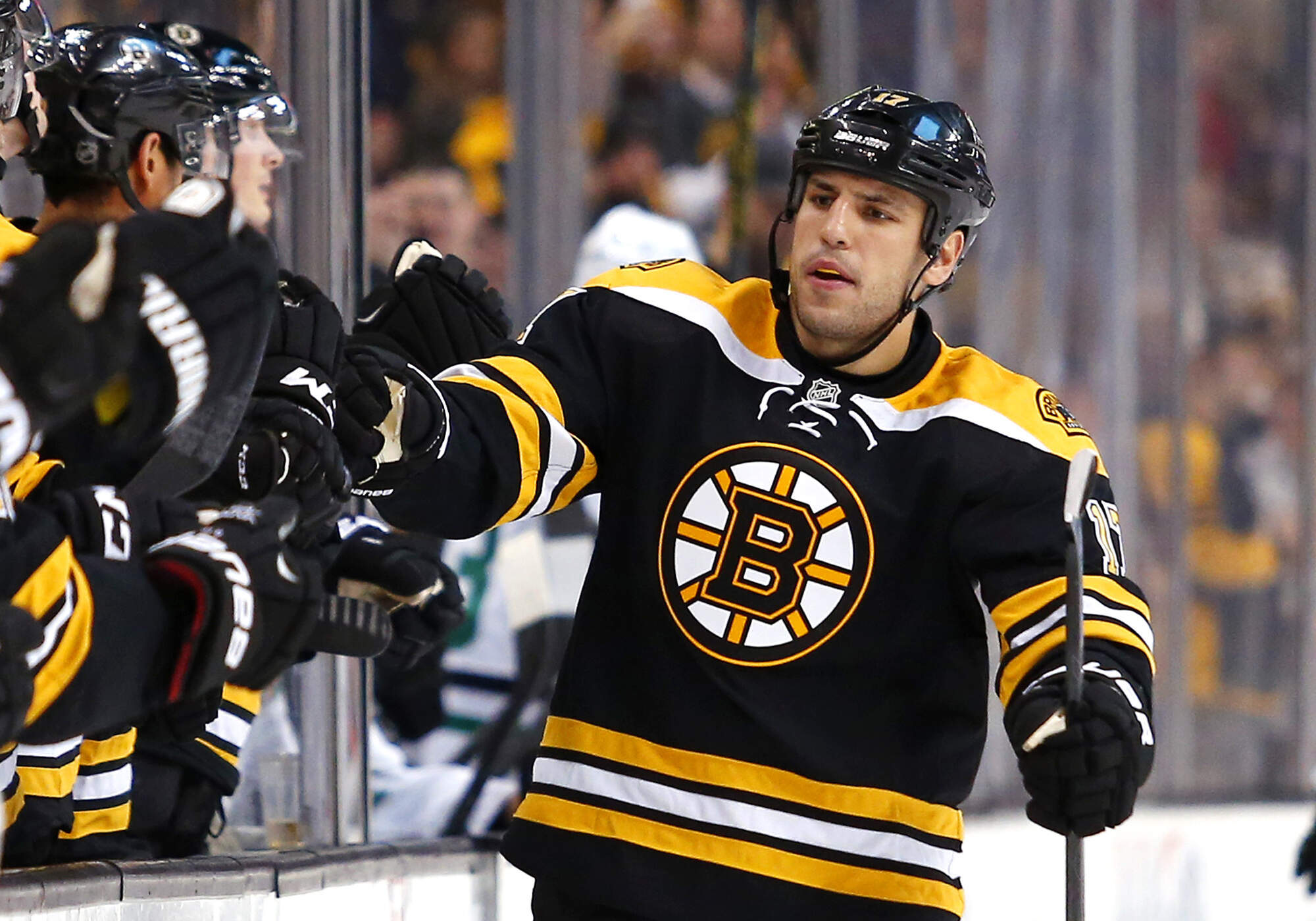 Boston Bruins' Milan Lucic is congratulated after a Boston goal against the Dallas Stars during an NHL hockey game in Boston on Feb. 10, 2015. (Winslow Townson/AP)