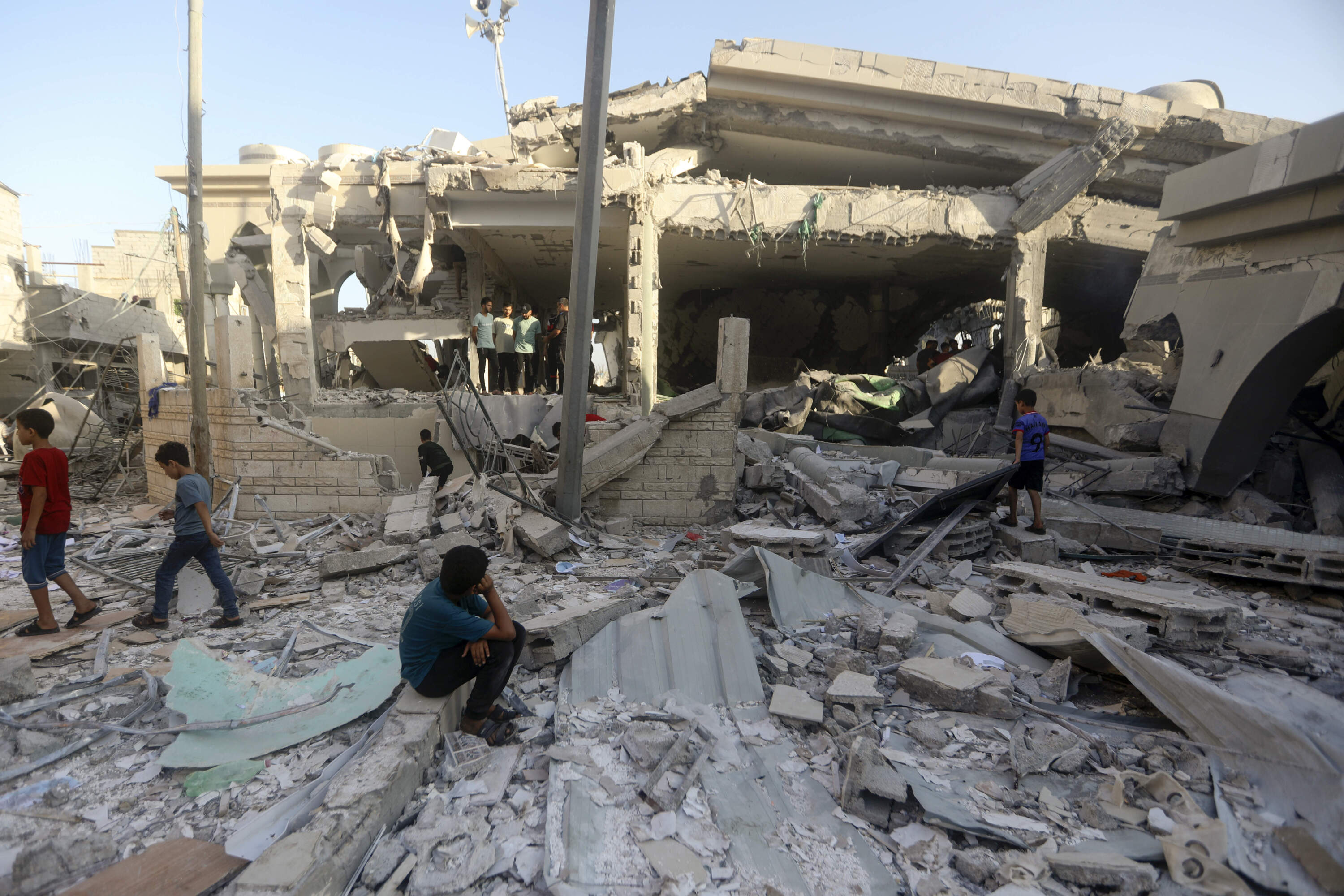 Palestinians inspect the damage of a destroyed mosque following an Israeli airstrike in Khan Younis refugee camp, southern Gaza Strip, Wednesday. (Mohammed Dahman/AP)