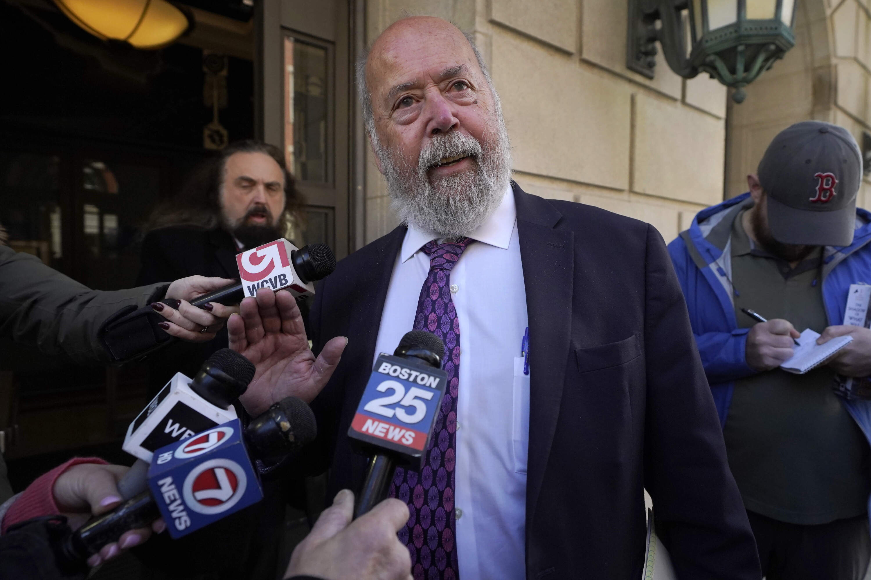 John Amabile, center, an attorney for Junmyung Lee, departs federal court, Monday, Nov. 13, 2023, in Worcester, Mass. (Steven Senne/AP)