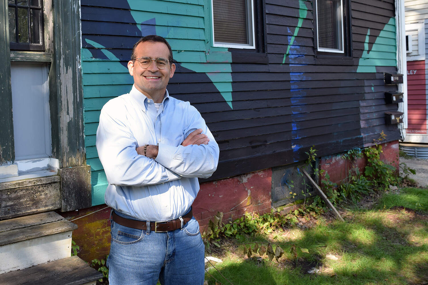 Seth Berry, a former Maine state legislator who first introduced the bill for a statewide public power company, standing outside a building in Brunswick, Maine.