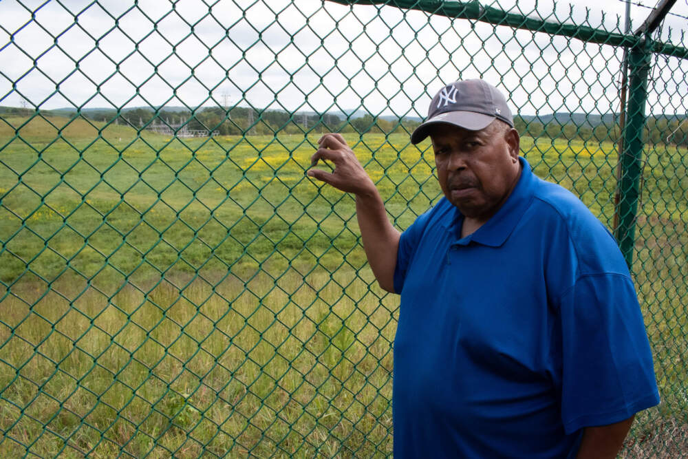 Former Alcoa employee Richard Leak of West Badin stands in front of the Alcoa-Badin Landfill. (Courtesy of Zachary Turner)