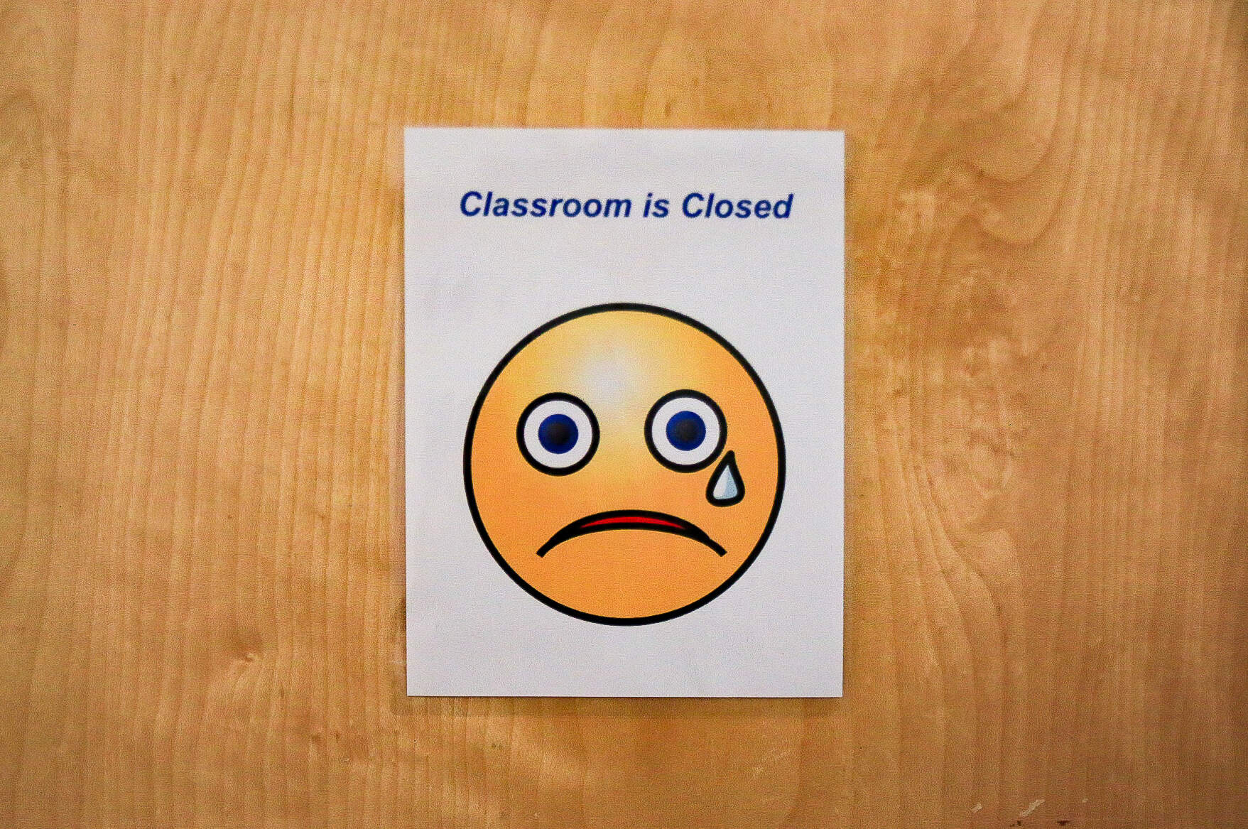A sign on a closed classroom at ABCD East Boston. (Emily Piper-Vallillo/WBUR)