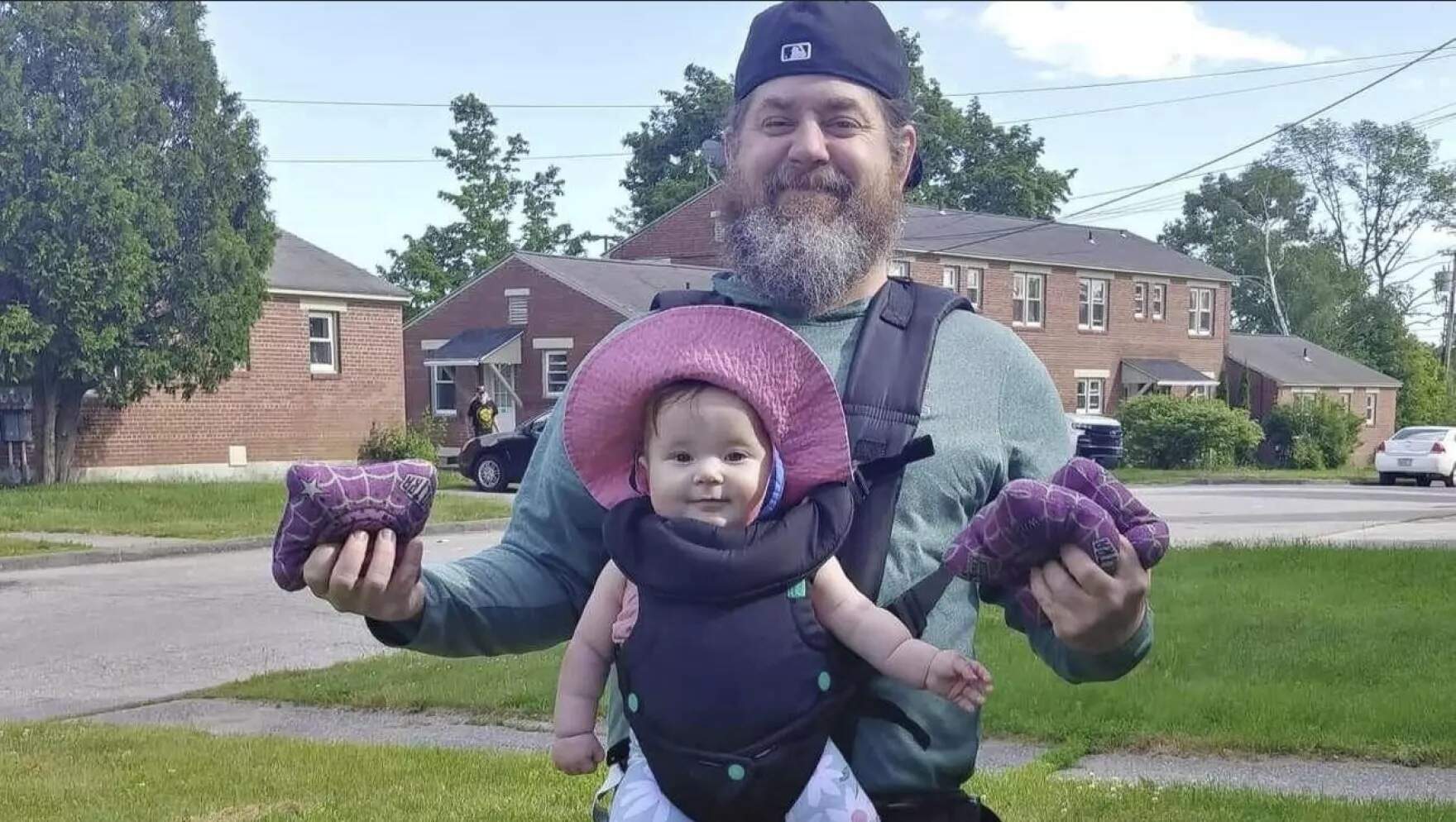 Peyton Brewer-Ross with his daughter Elle. (Courtesy Of Ralph Wellman-Brewer via Maine Public)