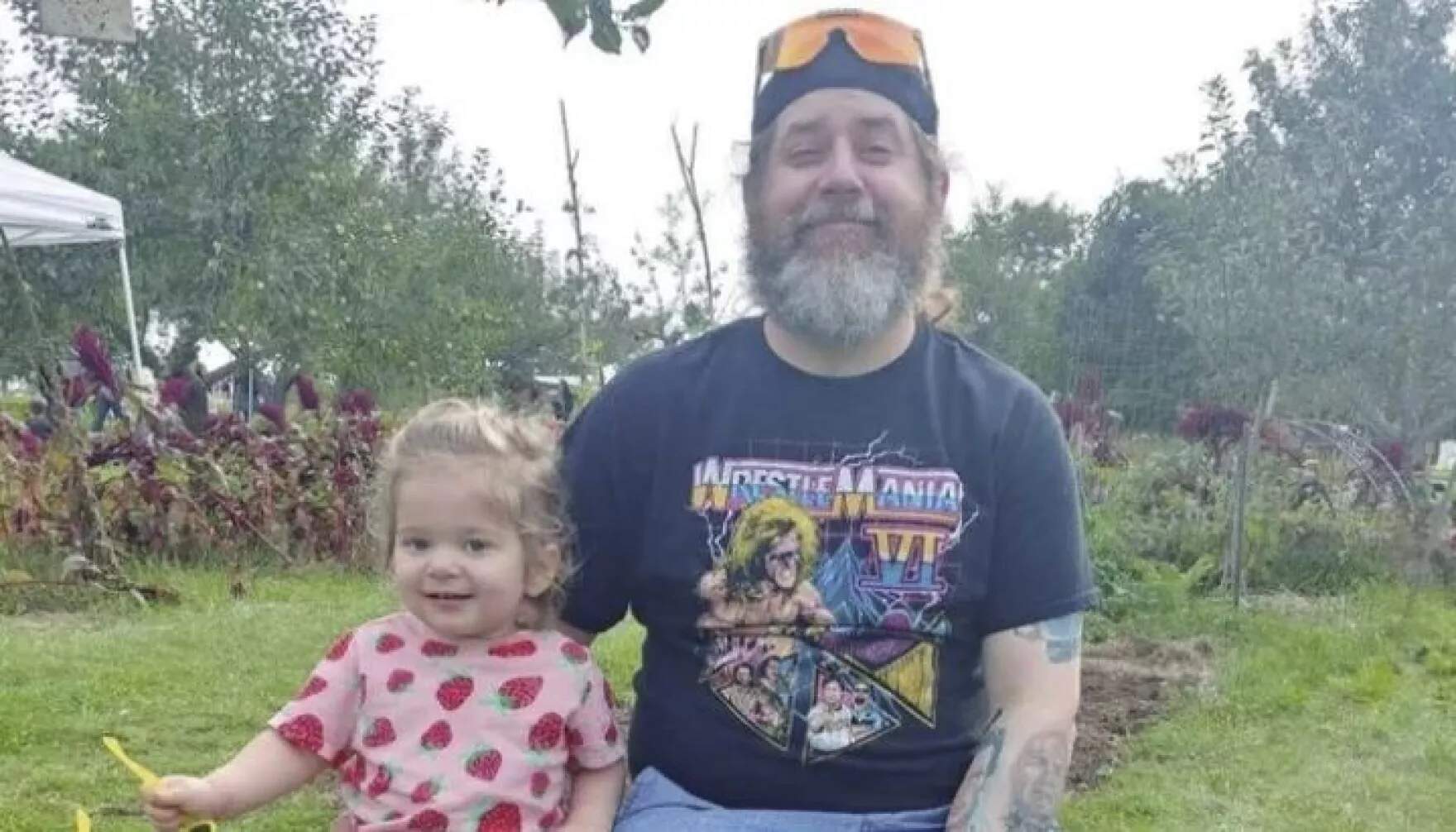 Peyton Brewer-Ross from Bath, Maine was one of the 18 people killed in a mass shooting in Lewiston, Maine on Oct. 25, 2023. He's pictured here with his 2-year-old daughter Elle. (Courtesy Of Ralph Wellman-Brewer via Maine Public)
