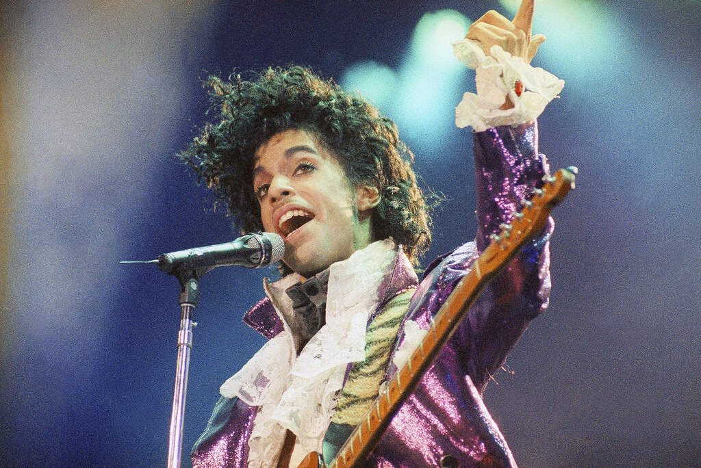 Prince performs at the Forum, Feb. 18, 1985, in Inglewood, Calif. (Liu Heung Shing/AP)