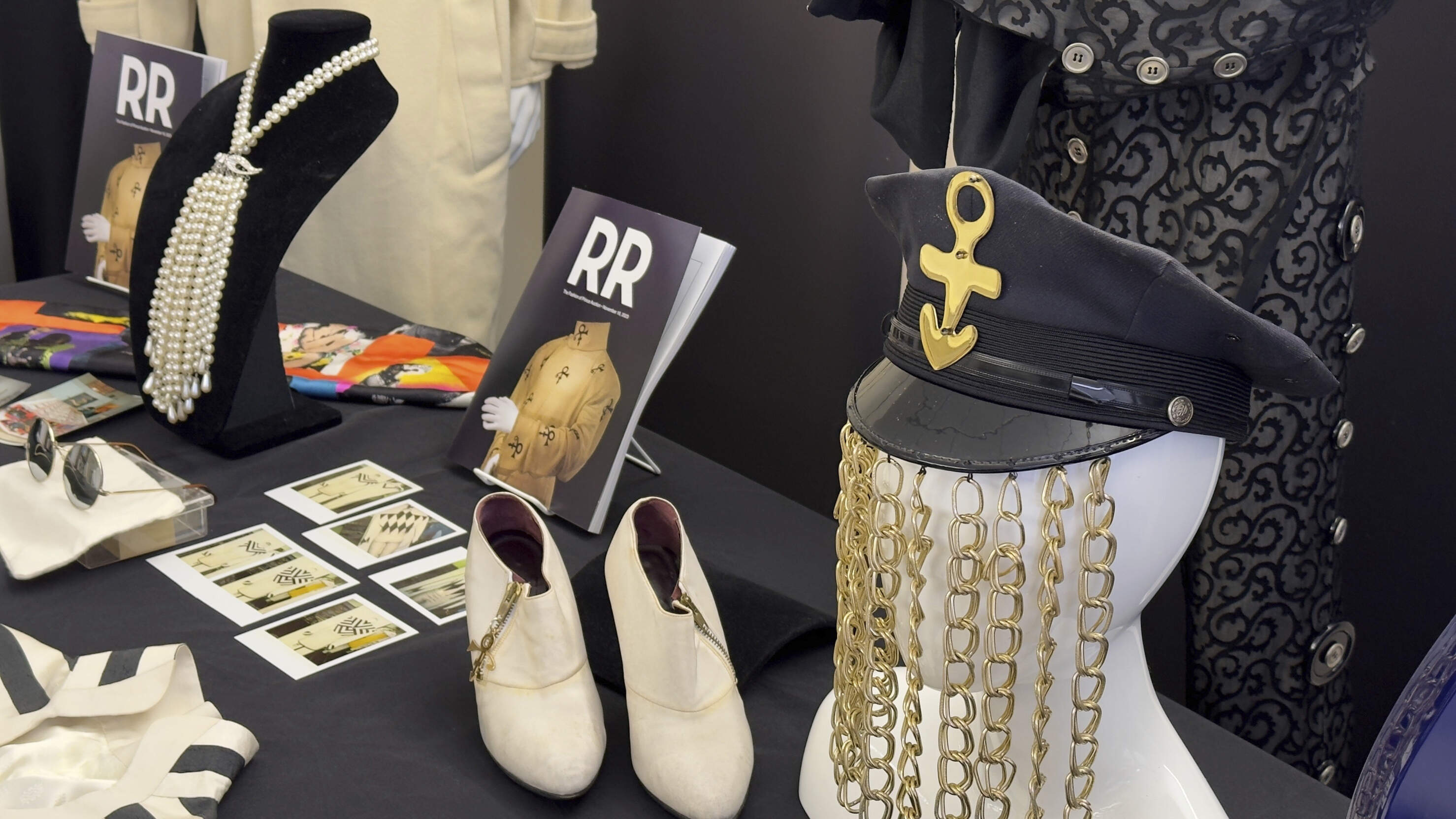 Some of the distinctive fashion pieces worn by the late pop superstar Prince appear on display at an auction house in Amherst, N.H., Monday, Nov. 13, 2023, as fans prepare to celebrate the 40th anniversary of "Purple Rain." (Rodrique Ngowi/AP)