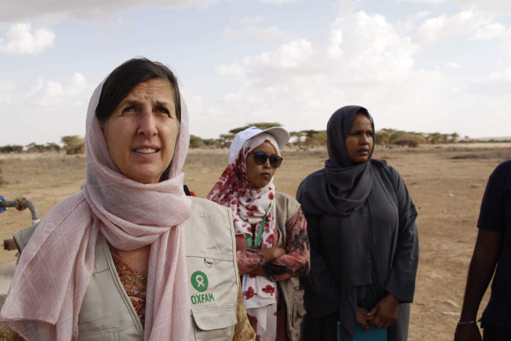 Abby Maxman in Somaliland in 2022. In Somaliland, Oxfam is helping people affected by four years of drought and displaced from their homes to access clean water, sanitation systems, and cash to help them survive. To assist livestock herders who have lost all their animals, Oxfam is teaching people to grow vegetables and grain as an alternative way to earn a living. (Chris Hufstader/ Oxfam)