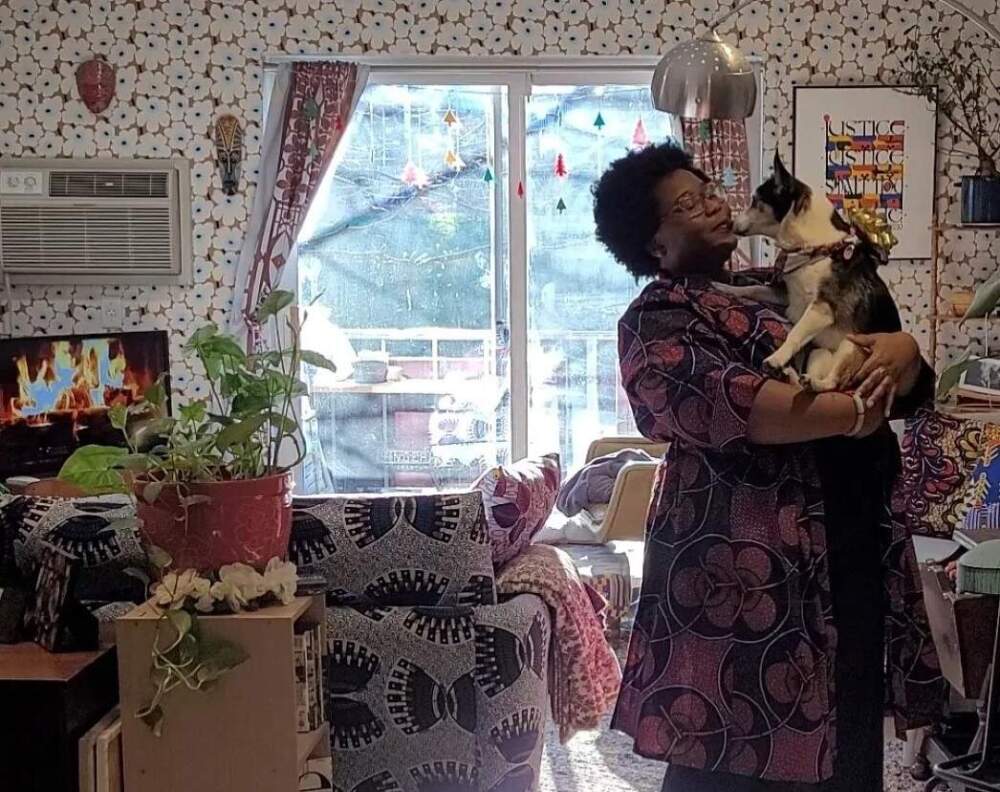 Theresa Okokon and her dog, Minnie, at her home in Chelsea. (Courtesy Theresa Okokon)