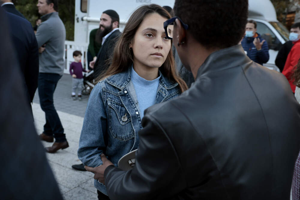 On Oct. 13, days after Hamas' attack on Israelis, a Harvard student is embraced by Harvard President Claudine Gay during Shabbat 1000 in the Science Center Plaza at Harvard University. (Craig F. Walker/The Boston Globe via Getty Images)