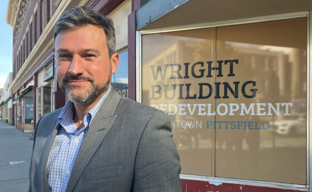 John Krol, a candidate for mayor of Pittsfield, MA stands in front of the Wright Building. He said if market rate housing could be built here, it would help revitalize the city's downtown. (Nancy Eve Cohen/NEPM)
