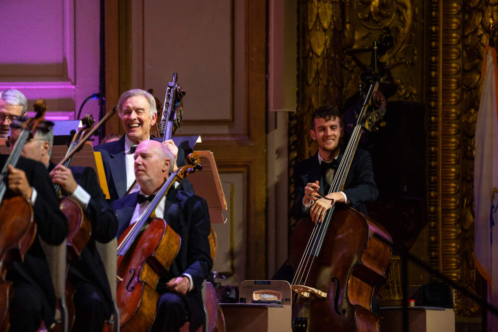 Larry Wolfe, standing second from right, onstage during the 2019 Holiday Pops Company Celebration. (Courtesy Robert Torres/Boston Symphony Orchestra)
