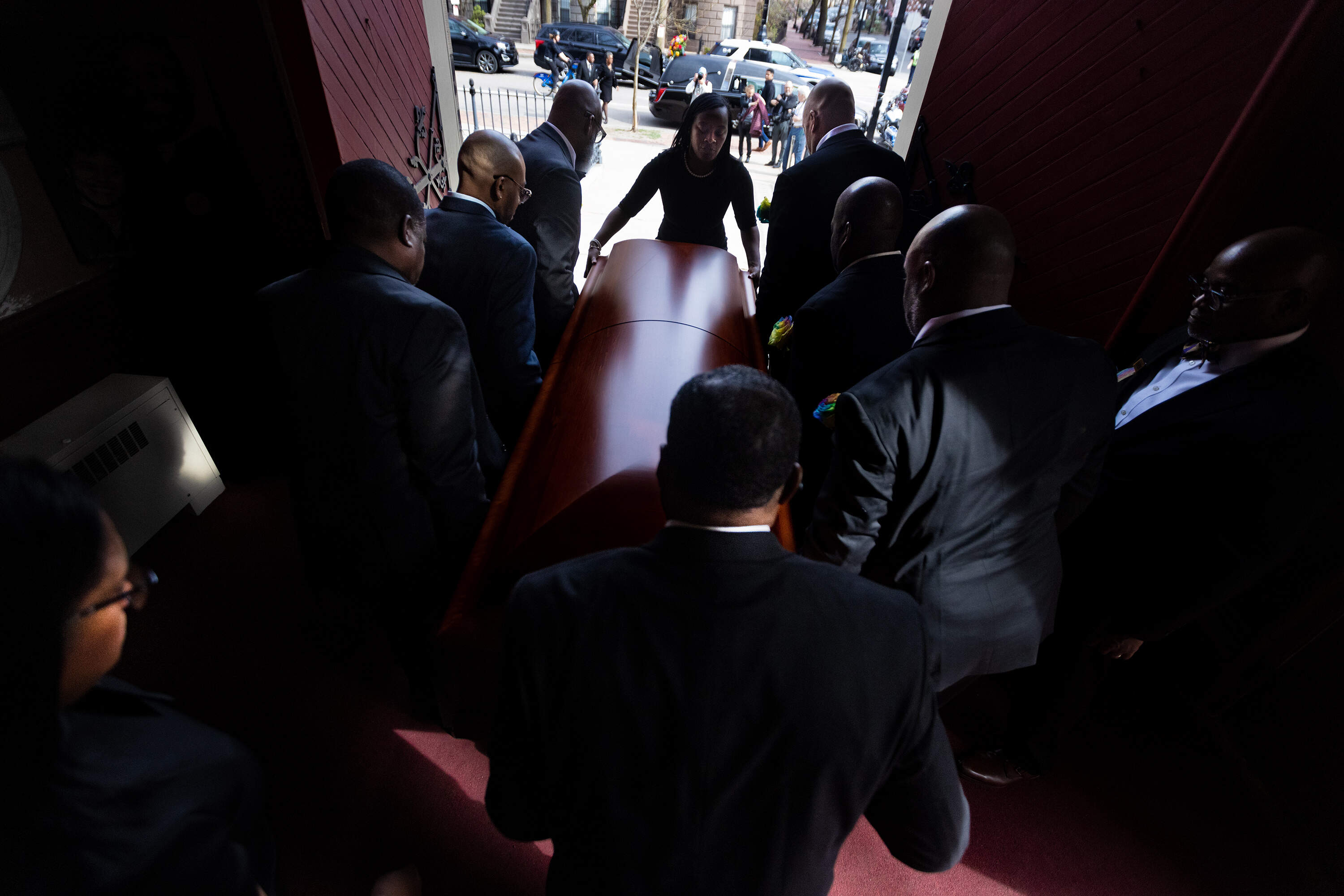 Pallbearers carry the casket of Mel King out the doors of Union United Methodist Church after the conclusion of the funeral service. (Jesse Costa/WBUR)