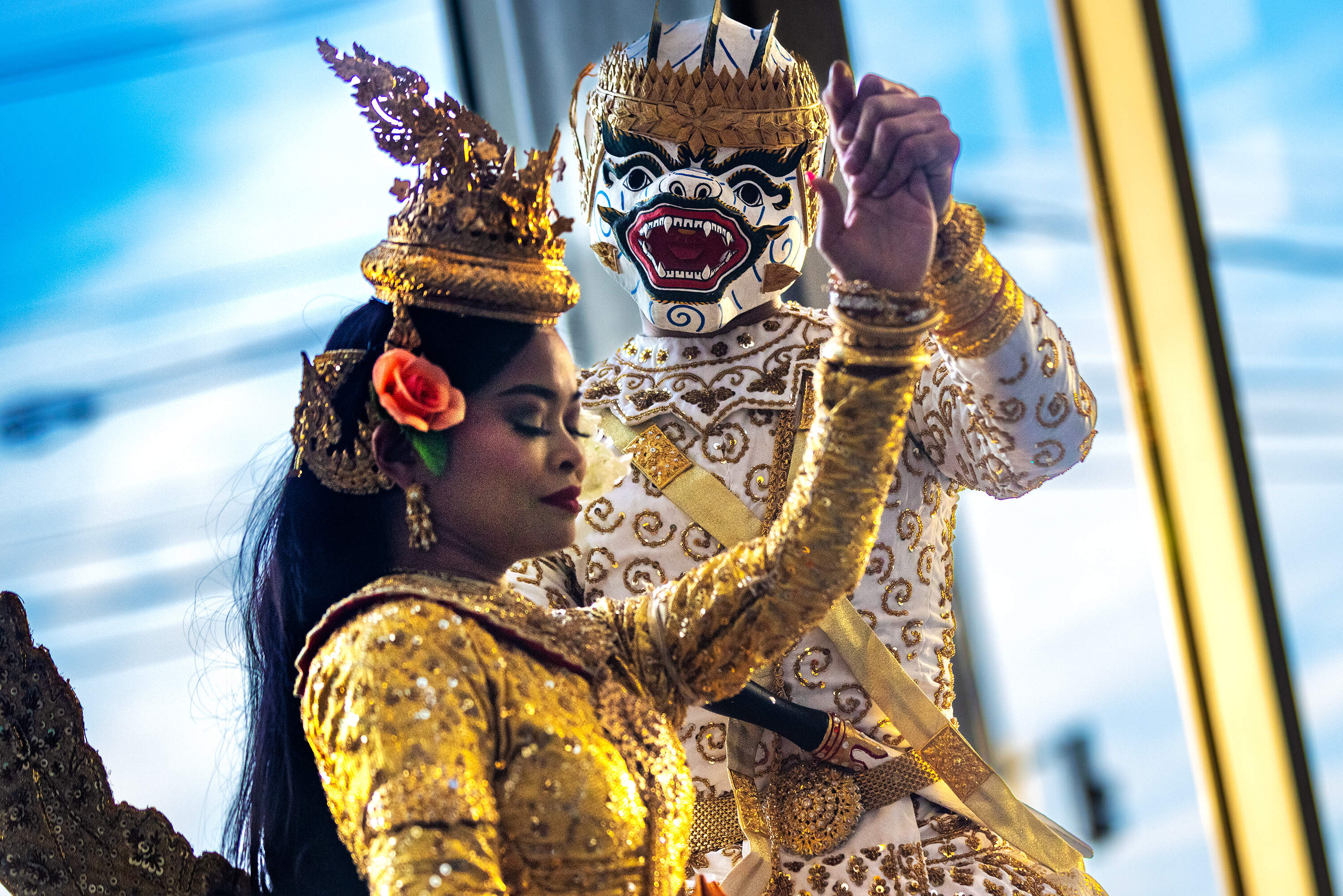 Channa Sath and Nicky Fennell perform the traditional Cambodian dance, Sovann Maccha, during a performance by the Angkor Dance Troupe performance at the UMass Lowell. (Jesse Costa/WBUR)