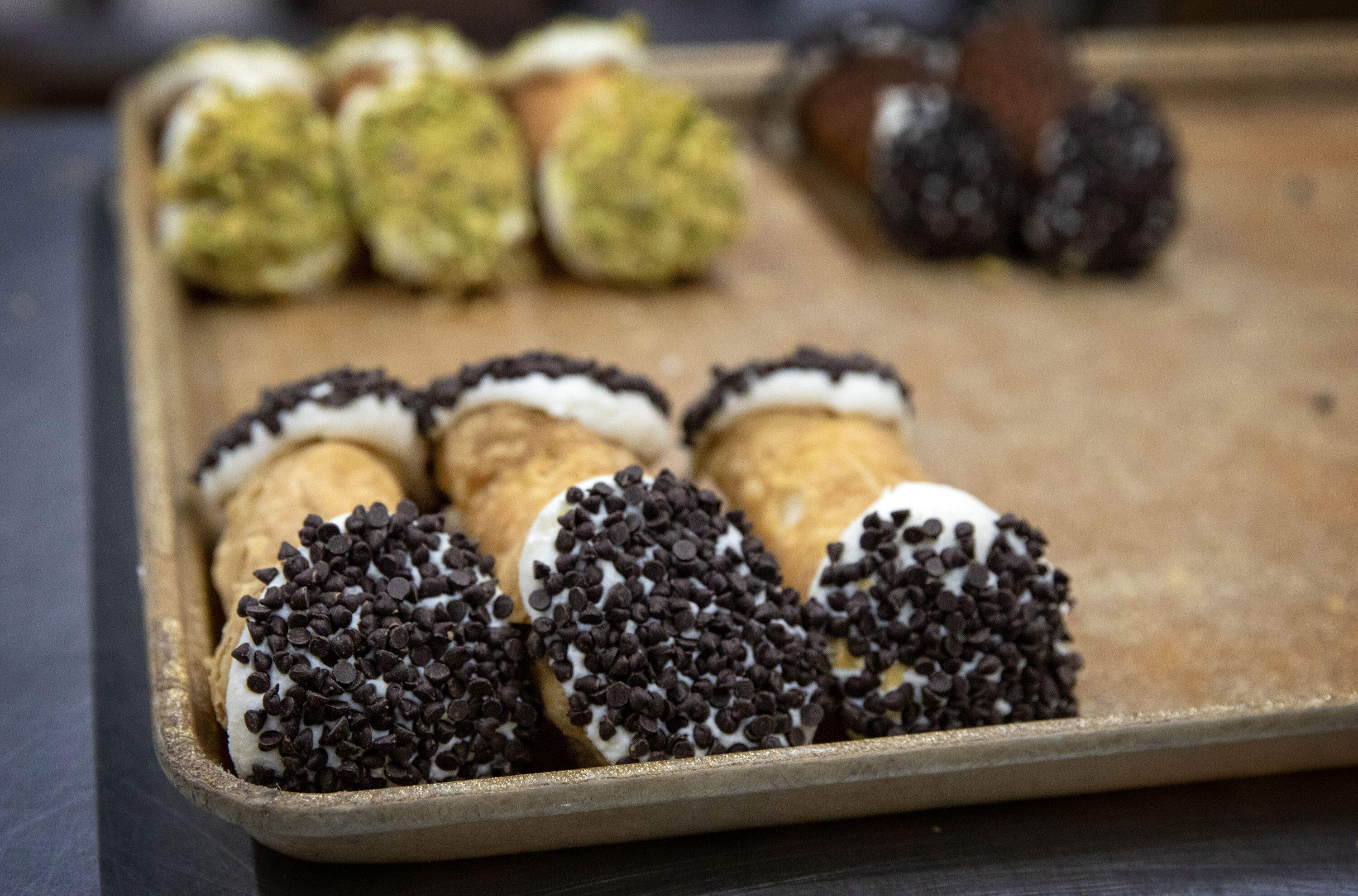 Cannolis in various flavors at Mike's Pastry on Hanover Street in Boston's North End. (Robin Lubbock/WBUR)
