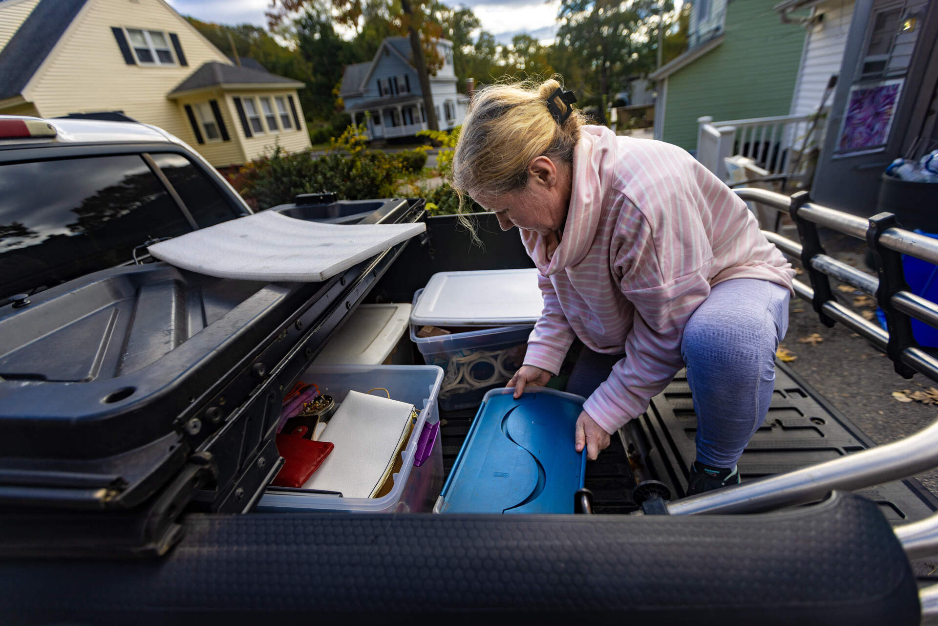 Deborah Libby loads her belongings into her pick-up truck as she is being evicted from her apartment in Worcester. (Jesse Costa/WBUR)