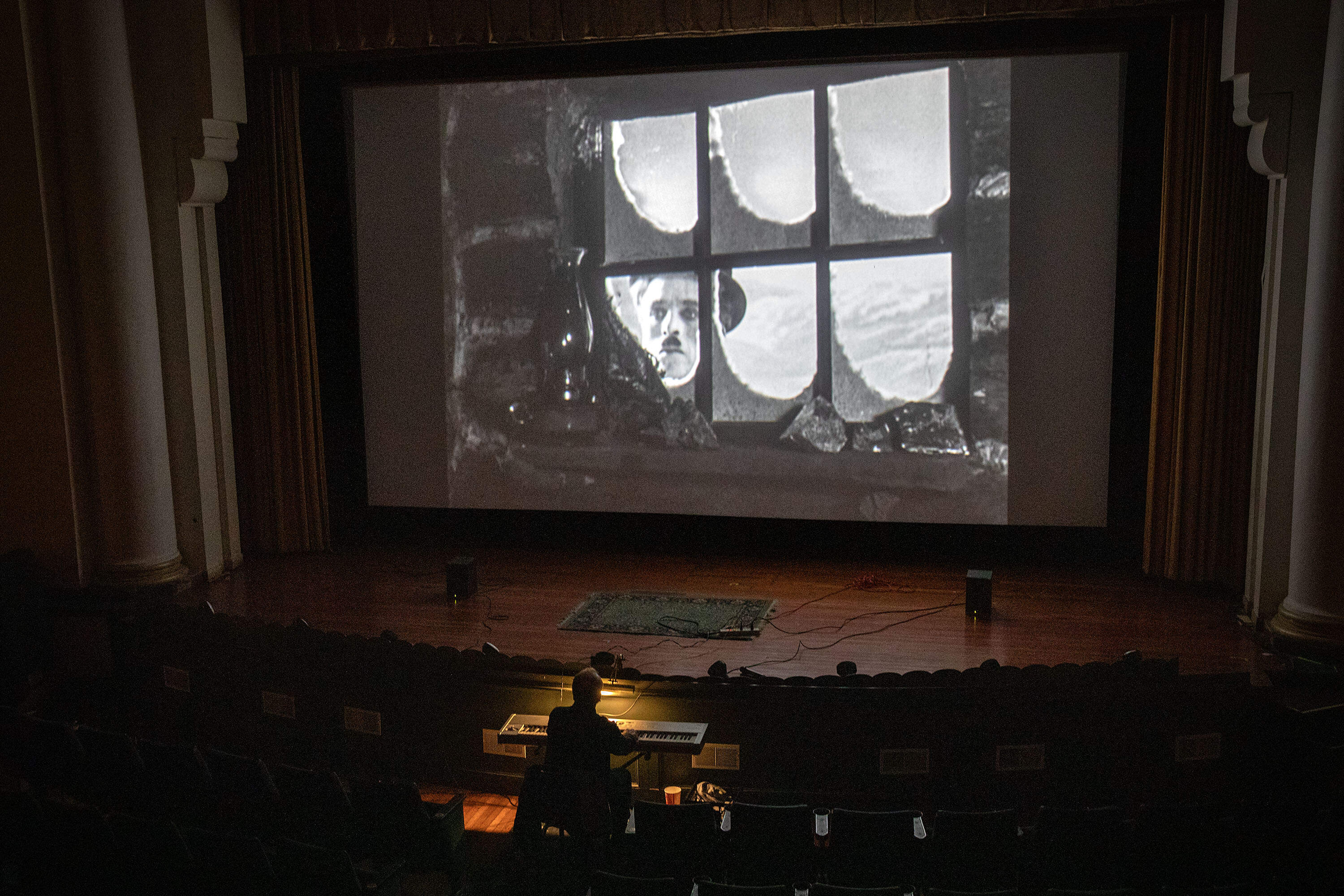 Jeff Rapsis plays music to accompany "The Gold Rush" starring Charlie Chaplin, at the Jane Pickens Theatre in Newport, Rhode Island.