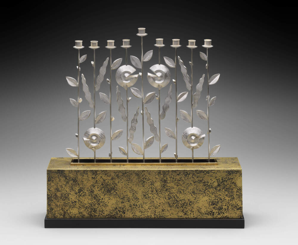The opening of the MFA’s new Judaica gallery includes this Hanukkah lamp (1999), in silver, bronze and walnut, by American artist Linda Threadgill. There’s one candle holder for each night of the eight-day holiday, known as the Festival of Lights. The slightly raised center holder is for the ninth candle, known as the shamash, which is used to light the other candles. (Courtesy Museum of Fine Arts, Boston)