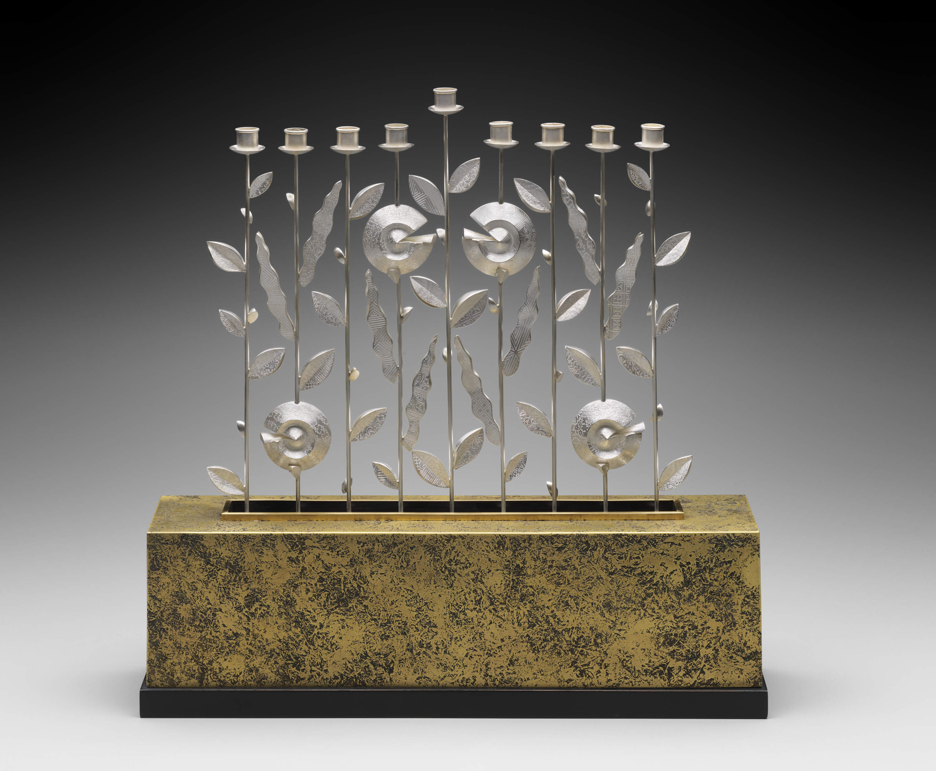 The opening of the MFA’s new Judaica gallery includes this Hanukkah lamp (1999), in silver, bronze and walnut, by American artist Linda Threadgill. There’s one candle holder for each night of the eight-day holiday, known as the Festival of Lights. The slightly raised center holder is for the ninth candle, known as the shamash, which is used to light the other candles. (Courtesy Museum of Fine Arts, Boston)