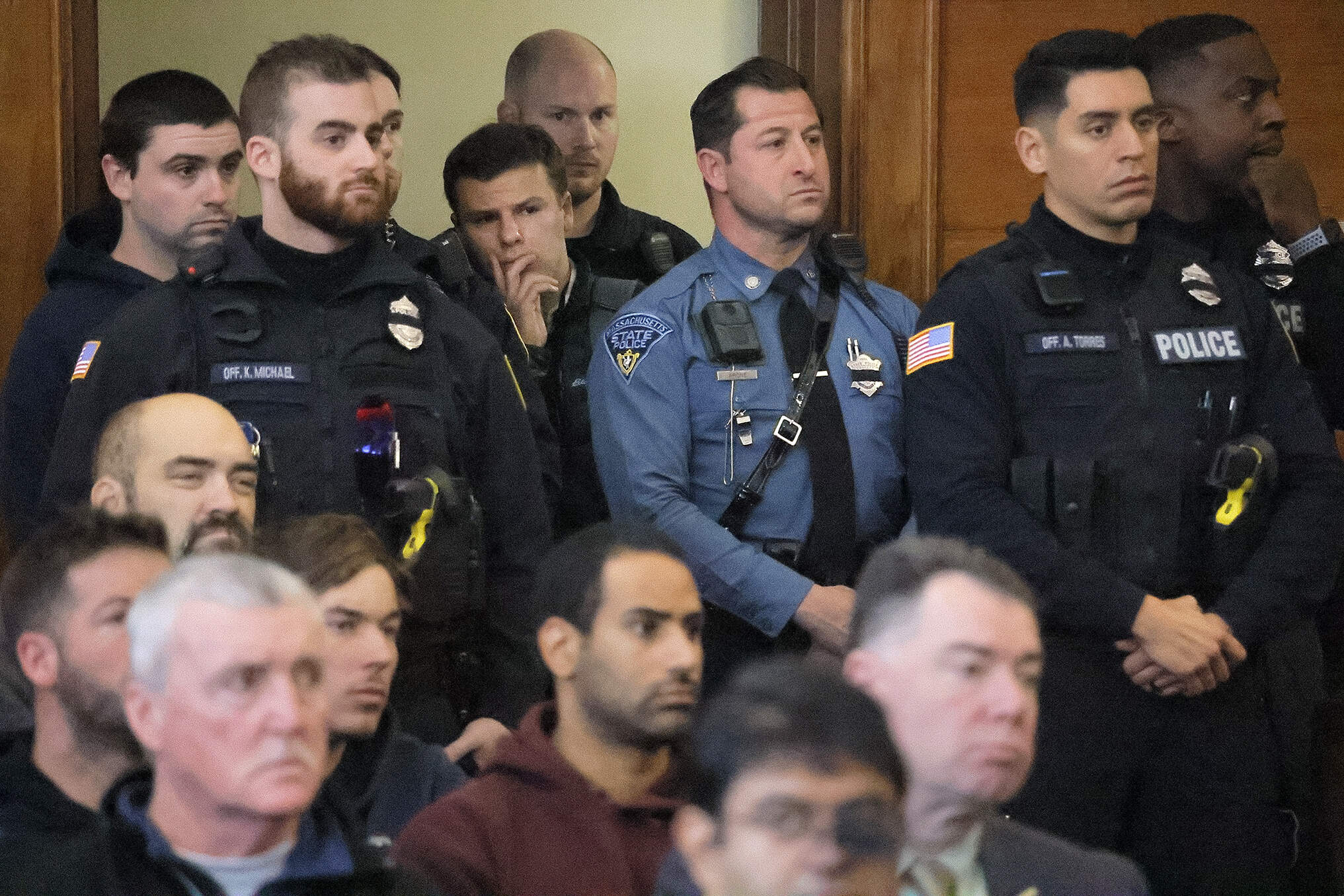 An overflow crowd of families, police, and utility workers fill the court in Waltham on Thursday as Peter Simon was arraigned on a litany of charges including manslaughter. (Lane Turner/The Boston Globe via AP, Pool)
