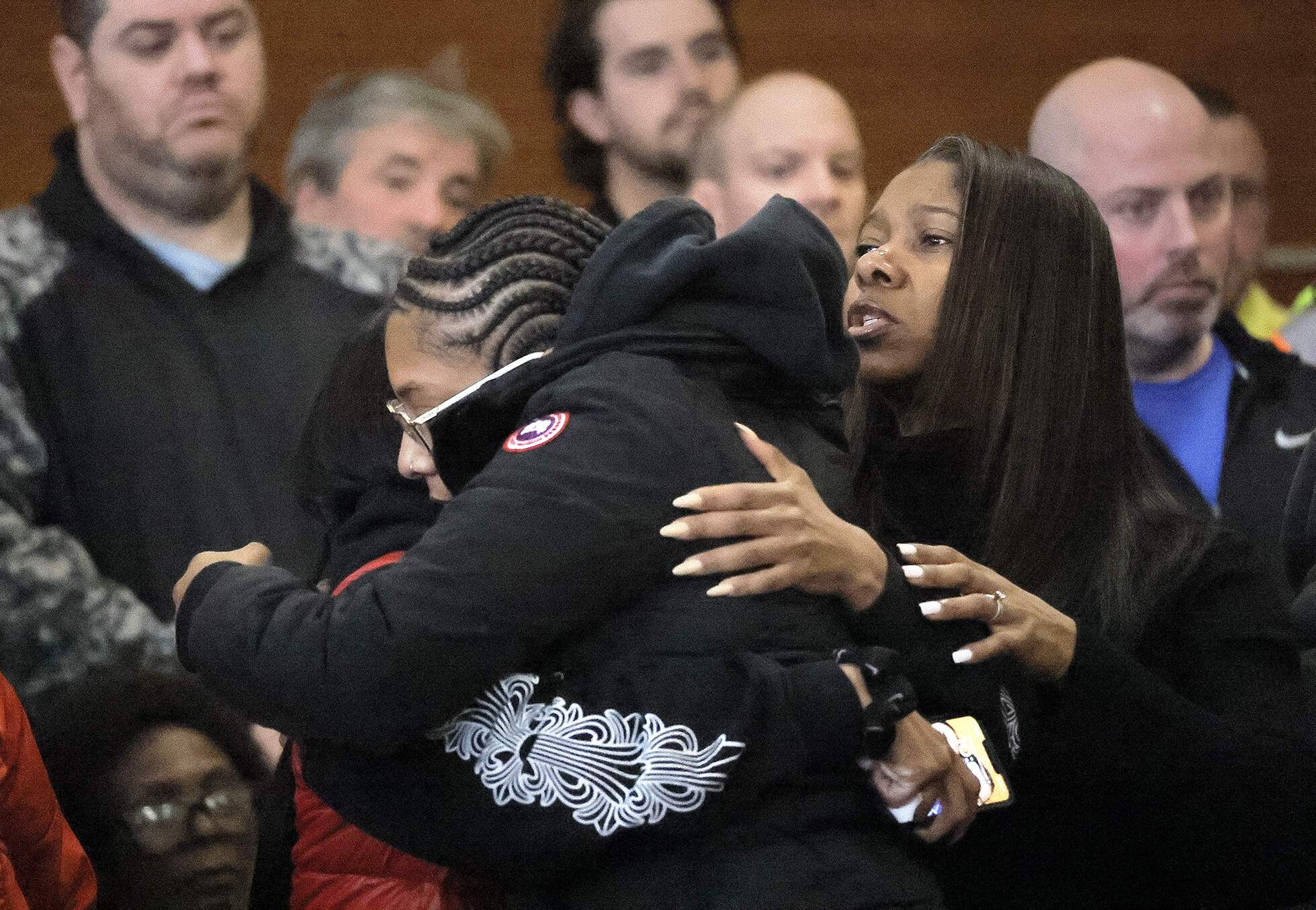 Family, police, and utility workers in the court room before the arraignment on Thursday. (Lane Turner/The Boston Globe via AP, Pool)