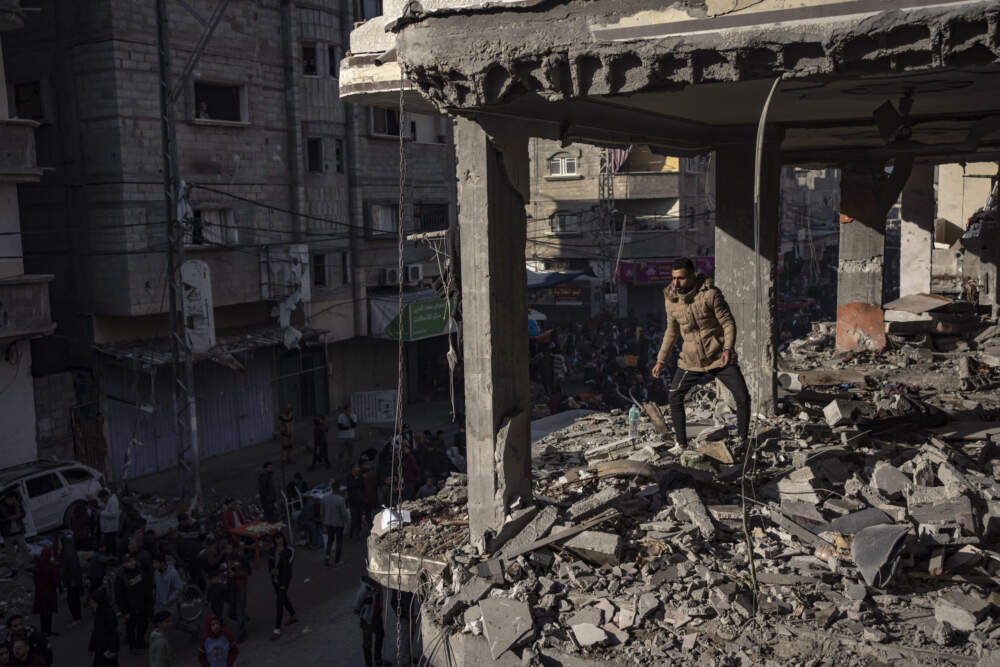 Palestinians check a house destroyed in the Israeli bombardment on Rafah, Gaza Strip, Monday, Dec. 11, 2023. (Fatima Shbair/AP)
