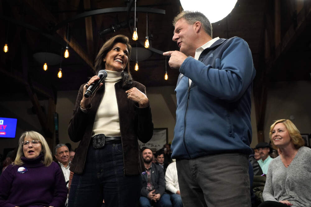 Republican presidential candidate Nikki Haley and New Hampshire Gov. Chris Sununu appear at a town hall campaign event on Tuesday, Dec. 12, in Manchester. (Robert F. Bukaty/AP)