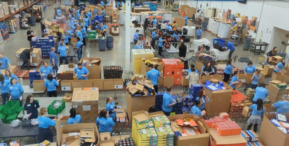 Volunteers working at the Northern Illinois Food Bank. To date, it's brought in 400,000 more pounds of food because of a federal program that connects farms with food pantries in an effort to cut down on food waste. (Courtesy of Northern Illinois Food Bank)