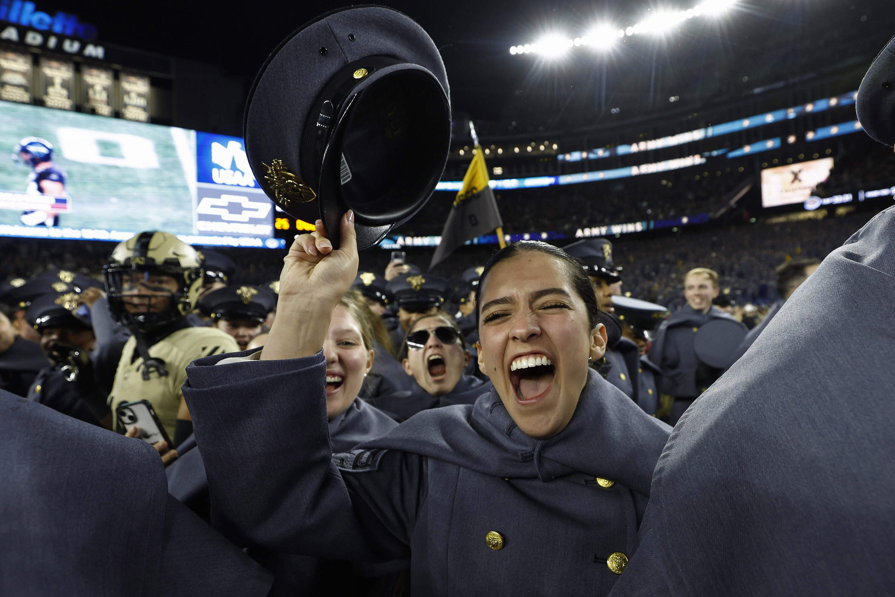 Army Cadets storm the field after defeating the Navy at Gillette Stadium.(Winslow Townson/AP)