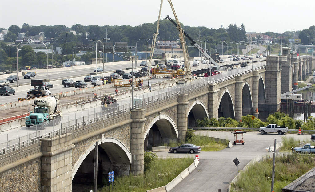 Construction crews work on the eastbound lanes of the Washington Bridge in Providence, R.I., Aug. 4, 2007. (Stew Milne/AP)