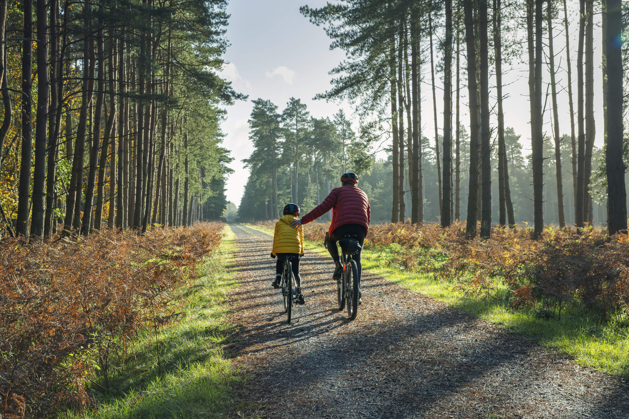 A child and parent ride bikes together. (Justin Paget/Getty Images)