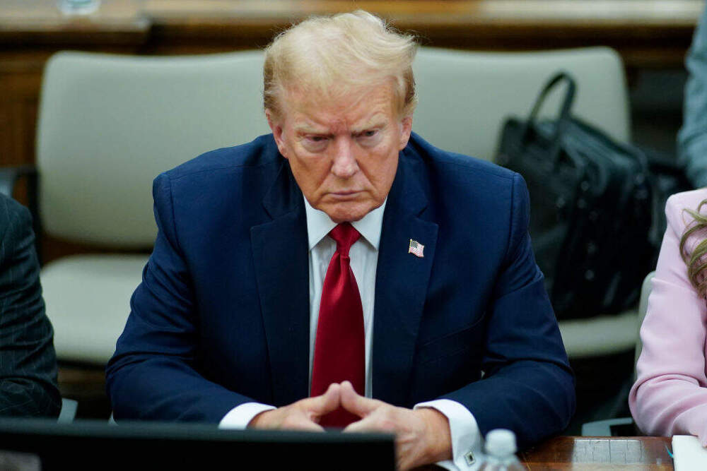 Former U.S. President Donald Trump sits at the defense table while waiting for proceedings to begin in his civil business fraud trial in New York State Supreme Court on December 7, 2023 in New York City. Trump's civil fraud trial alleges that he and his two sons Donald Trump Jr. and Eric Trump conspired to inflate his net worth on financial statements provided to banks and insurers to secure loans. New York Attorney General Letitia James has sued seeking $250 million in damages. (Photo by Eduardo Munoz Alvarez-Pool/Getty Images)