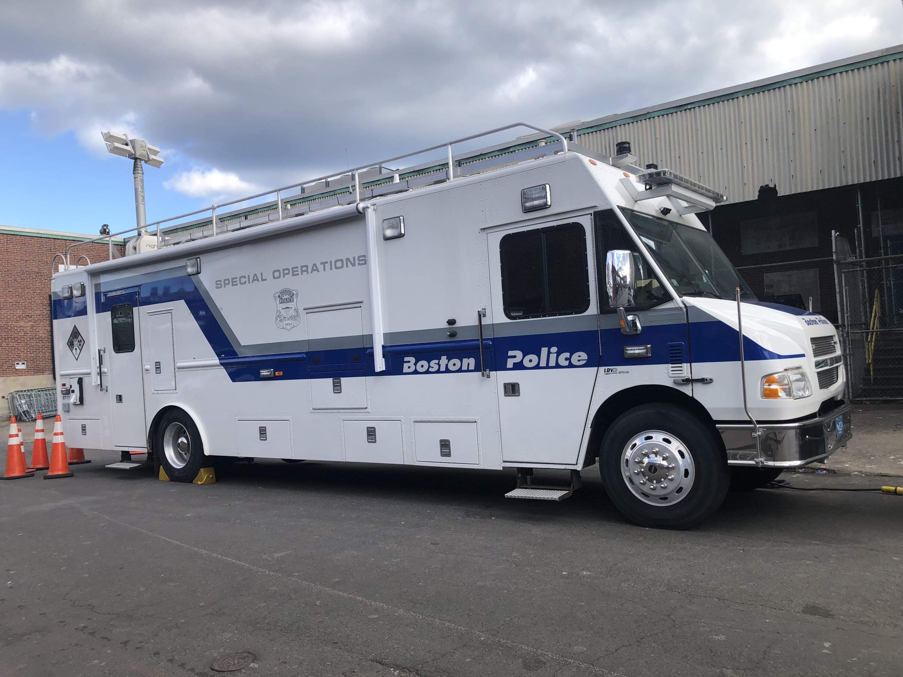 A Boston Police Department trailer parked in the area where police and city workers cleared a tent encampment in early November. (Deborah Becker/WBUR)
