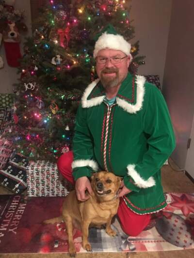 Joe Walker in his elf suit. (Courtesy of Bethany Welch via Maine Public)
