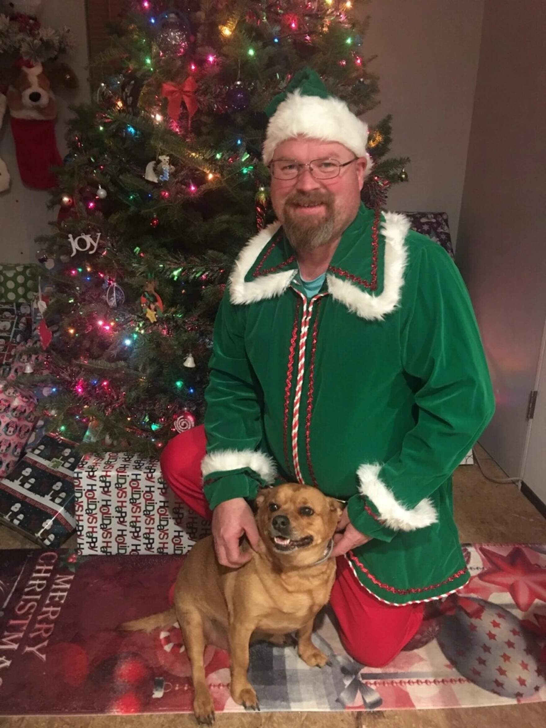 Joe Walker in his elf suit. (Courtesy of Bethany Welch via Maine Public)