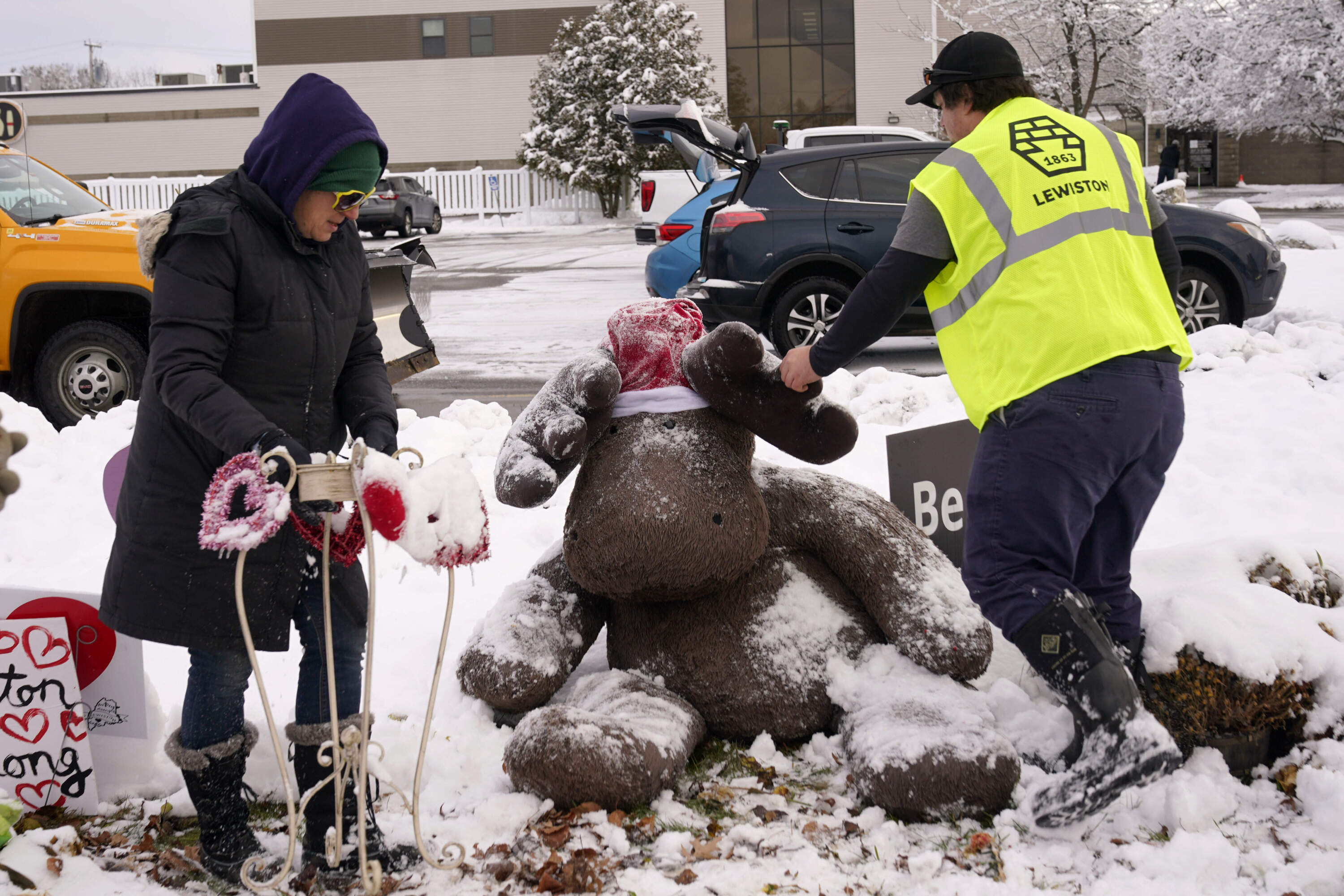A large stuffed moose is cleared of snow before being packed away.(Robert F. Bukaty/AP)