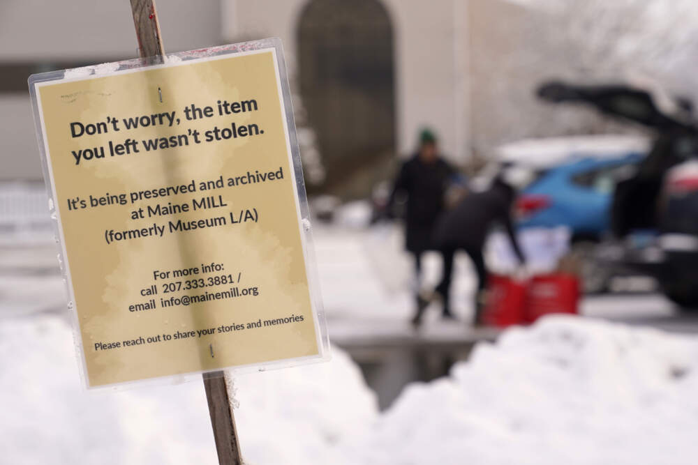 A sign announces the beginning of a project to preserve items left at makeshift memorials for the victims of last month's mass shooting in Lewiston, Maine. (Robert F. Bukaty/AP)