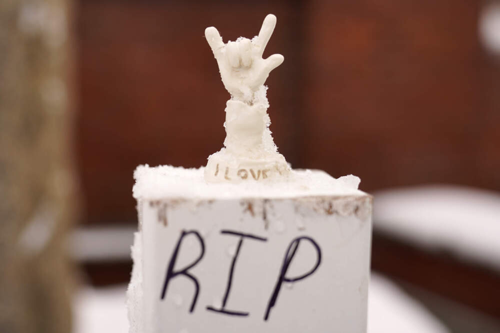 A small statue depicting &quot;I love you&quot; at a makeshift memorial. (Robert F. Bukaty/AP)