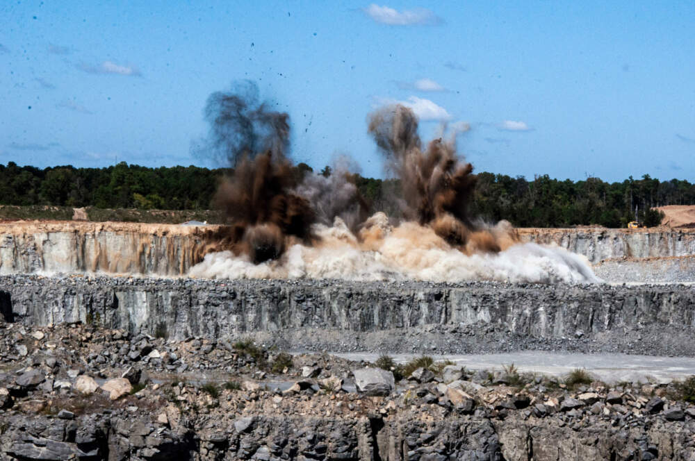50,000 tons of stone are blown up at the Sunrock Quarry in Butner, North Carolina. (Chris Bentley/Here & Now)
