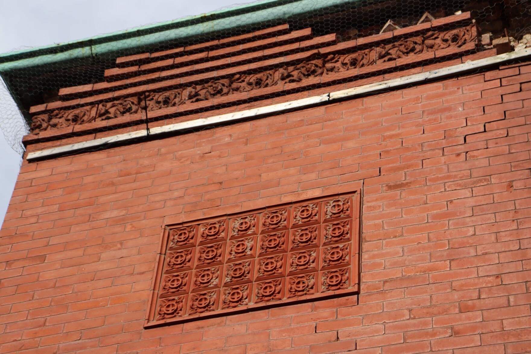 "You can see the beautiful flower floral motifs there," Professor Nea Maloo said. "Can you imagine a firehouse like this? Nowadays firehouses are not that dressed up. [But] because it was a part of the community, they dressed it as their own." (Eve Zuckoff/CAI)
