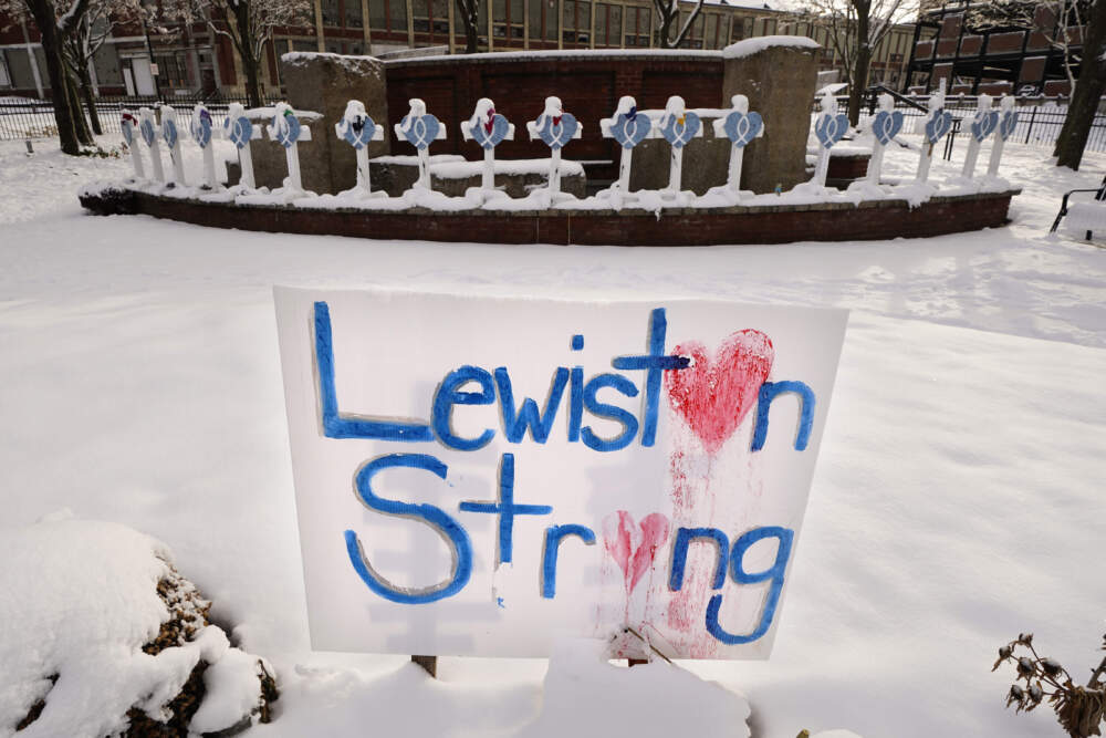 Recent snowfall coats crosses at one of several memorials for the victims of last month's mass shooting in Lewiston, Maine on Dec. 5. (Robert F. Bukaty/AP)