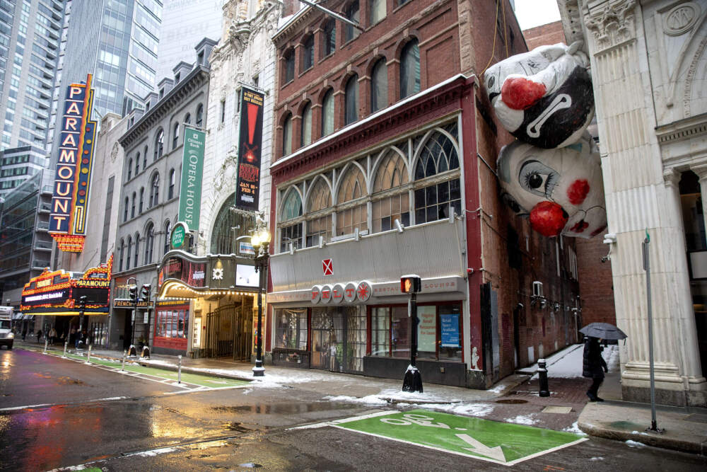 "End Game", a giant balloon sculpture by Max Streicher, squeezes between the buildings on Harlem Place Alley, as part of the Downtown Boston Business Improvement District's Winteractive art exhibit. (Robin Lubbock/WBUR)